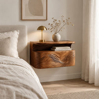 Floating nightstand with a carved wave front and an open nook under the top in a Scandinavian bedroom with white walls