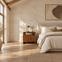 Nightstand with an open top cubby and a looped side frame in a bright open plan bedroom