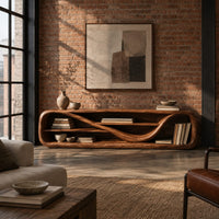 Low open capsule shaped media console with a winding shelf running through it in an industrial loft living room with exposed brick