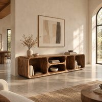 Low tv stand with soft edges and a stacked pair of oval cubbies in a bright open plan living room