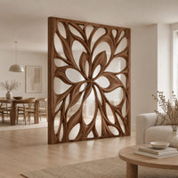 Room divider with a large open flower pattern of sweeping petals in a Scandinavian open-plan living room with white walls