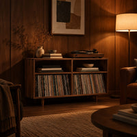 Open turntable stand with four square bays and short tapered legs in an evening living room with walnut wall paneling