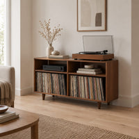 Open turntable stand with four square bays and short tapered legs in a Scandinavian living room with white walls