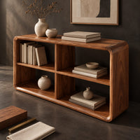 Corner detail of open frame console table with four cubbies and soft edges beside wood, brass and linen samples