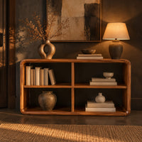 Open frame console table with four cubbies and soft edges in a dark entryway at golden hour