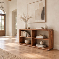 Open frame console table with four cubbies and soft edges in a bright open plan entryway