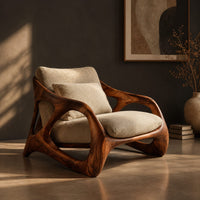 Open frame wooden lounge chair with thick sculpted loops and cream cushions, three-quarter view showing the grain