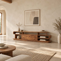 Low tv stand with open cubbies, a wide center panel and stacked end shelves in a bright open plan living room