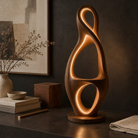 Corner detail of tall floor lamp shaped as a looping figure eight with a small shelf beside wood, brass and linen samples