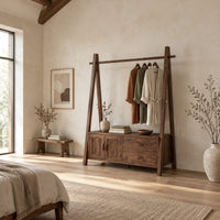 Open rail wardrobe with slanted side posts and a low cabinet base in a bright open plan bedroom