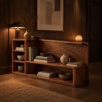 Open shelf console table with a grain back panel and a side cubby stack in an evening entryway with walnut wall paneling