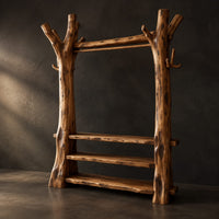 Open wardrobe with tree trunk posts, a hanging rail and three plank shelves, three-quarter view showing the grain