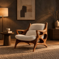 Openwork wooden lounge chair with hollowed arms and splayed legs in a dark living room at golden hour