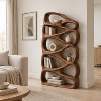 Bookshelf made of stacked open teardrop shaped shelves in a Scandinavian living room with white walls