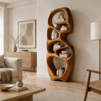 Tall organic wooden bookshelf with uneven oval shelf pockets in a Scandinavian living room with white walls