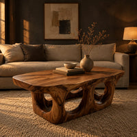 Coffee table with round porthole openings in a solid base in a dark living room at golden hour