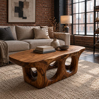 Coffee table with round porthole openings in a solid base in an industrial loft living room with exposed brick