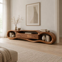 Organic loop shaped media stand with three center panels and open book nooks in a Scandinavian living room with white walls
