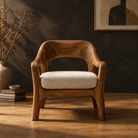 Open back chair with curved crest rail and splayed legs in a dark studio against a charcoal plaster wall