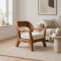 Open back chair with curved crest rail and splayed legs in a Scandinavian living room with white walls