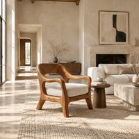 Open back chair with curved crest rail and splayed legs in a bright open plan living room