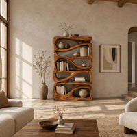 Stacked bookshelf with flowing teardrop shaped openings in a bright open plan living room