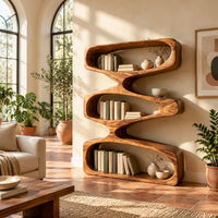 Bookshelf of three stacked open loops with pinched waists in a bright living room with arched windows and plants