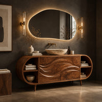 Corner detail of oval vanity cabinet on tapered legs with carved wave doors and open end shelves beside wood, brass and linen samples