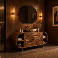 Oval vanity cabinet on tapered legs with carved wave doors and open end shelves in an evening bathroom with walnut wall paneling