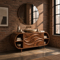 Oval vanity cabinet on tapered legs with carved wave doors and open end shelves in an industrial loft bathroom with exposed brick