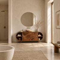 Oval vanity cabinet on tapered legs with carved wave doors and open end shelves in a bright open plan bathroom