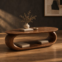 Oval coffee table on a thick pill shaped loop base with an open middle, three-quarter view showing the grain