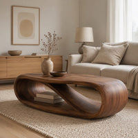 Oval coffee table with a twisting ribbon loop body and an open lower level in a Scandinavian living room with white walls