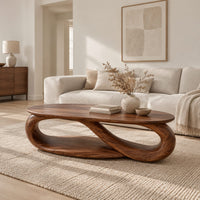 Oval coffee table with an infinity loop base and lower shelf in a Scandinavian living room with white walls