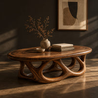 Oval coffee table on a base of interlocking open arches, three-quarter view showing the grain