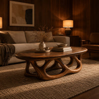 Oval coffee table on a base of interlocking open arches in an evening living room with walnut wall paneling