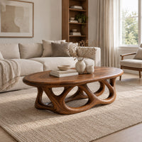Oval coffee table on a base of interlocking open arches in a Scandinavian living room with white walls