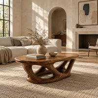 Oval coffee table on interlocking looped wooden legs with a thick top in a bright open plan living room