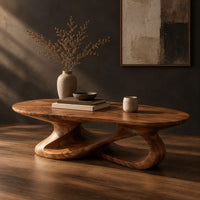 Oval coffee table on a looping ribbon base with open gaps, three-quarter view showing the grain