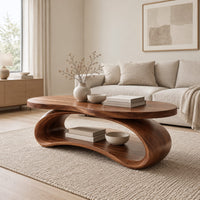 Oval wood coffee table on a looping ribbon base with an open lower shelf in a Scandinavian living room with white walls