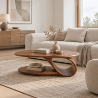 Oval coffee table with a low oval shelf and a single scroll support in a Scandinavian living room with white walls
