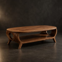 Oval coffee table with a lower shelf and flared legs with circular cutouts, three-quarter view showing the grain