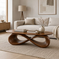Oval coffee table with a sculpted infinity loop base in a Scandinavian living room with white walls