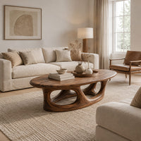 Oval coffee table with a thick edge and hollow arch base in a Scandinavian living room with white walls