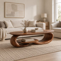 Oval coffee table on two curled legs with a small oval shelf below in a Scandinavian living room with white walls