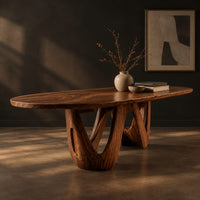 Oval dining table on a sculpted open base shaped like a w, three-quarter view showing the grain