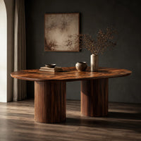 Oval dining table with two fluted cylinder bases, three-quarter view showing the grain