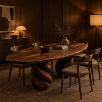 Oval dining table with two twisted rope pedestal bases in an evening dining room with walnut wall paneling