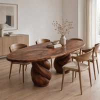 Oval dining table with two twisted rope pedestal bases in a Scandinavian dining room with white walls