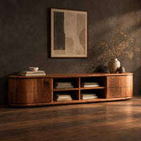 Oval ended tv stand with four open cubbies between two end cabinets, three-quarter view showing the grain